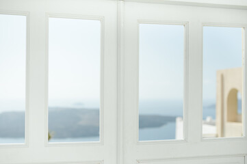 View of the Aegean Sea from Santorini through windows in doorway