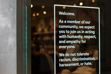 Welcome signage calling for respect and empathy for everyone and standing against racism,...