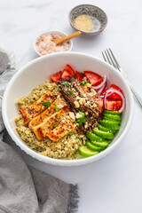 Healthy bowl with cauliflower rice, enoki mushrooms, chicken and vegetables.