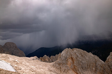 The view of Sassolungo and the Sella Group from Serauta in stormy weather in the Dolomites, Italy.