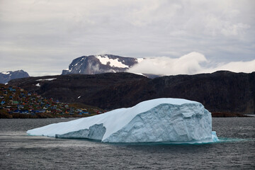 Coastal view with iceberg of Upernavik village a Greenlandic town in Upernavik District, Avannaata Communia © bummi100