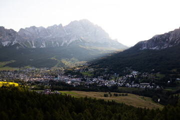 Fototapeta na wymiar Cortina d'Ampezzo town panoramic view with alpine green landscape and massive Dolomites Alps