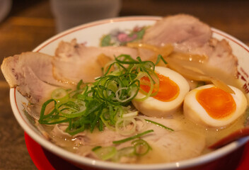 Top down view of a char siu (pork) ramen bowl with egg, Kyoto, Japan