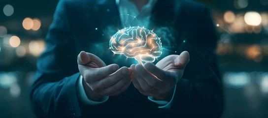 Fotobehang A businessman's hand holding a brain icon represents futuristic thinking and innovation. The bright, glowing brain icon floats above the hand, symbolizing creativity, and mind control. © jex