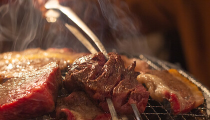 Japanese Yakiniku - barbecue grilled beef steak over charcoal stove in Osaka, Japan. Selective...