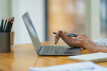 Woman hands typing on laptop computer closeup, businesswoman or student girl using laptop at home, online learning, internet marketing, working from home, office workplace freelance concept.