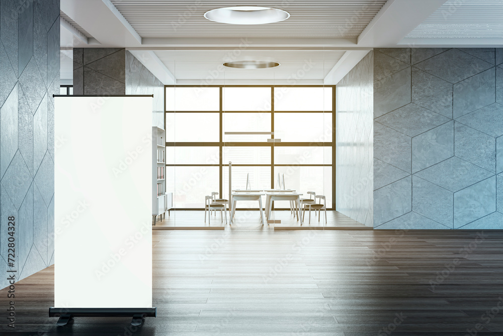 Poster Contemporary spacious coworking office room interior with empty white mock up roll up banner and various objects. 3D Rendering.