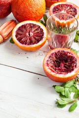 Blood Oranges and Fresh Mint on Wooden Surface