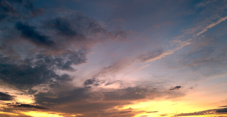 Dramatic Colorful Sunset Sky. Clouds with Sunrays. Cloudscape Sunset Background. Panorama Sky. Dramatic sky with clouds at sunset or sunrise. Sunset Sundown. Sky with colorful clouds.