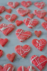 Fototapeta premium Heart shaped cookies with pink and white icing