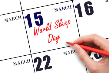 March 15. Hand writing text World Sleep Day on calendar date. Save the date.