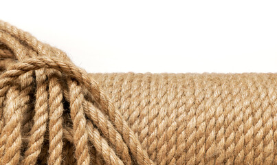 Fototapeta na wymiar Jute rope in a skein close-up on a white background. Natural organic threads. Environmentally friendly Material for creativity. Made from the Corchorus capsularis plant.