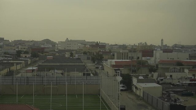 view of the city with soccer field from the train