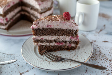 Slice of raspberry chocolate crem cake on a plate