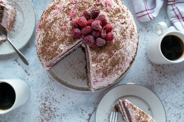 Raspberry chocolate cream cake. German cake or torte on light background 