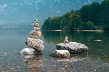 Stacked stones at lake Bohinj shoreline