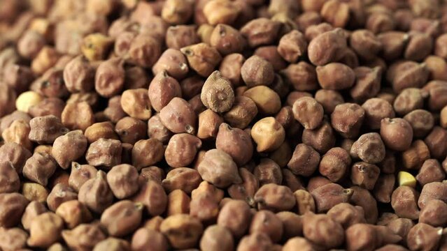 close up pile of raw black chickpea chick pea legume kala chana food background rotate 