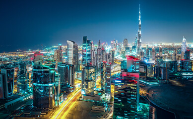 Fantastic nightime skyline of a big modern city. Downtown Dubai, United Arab Emirates. Colourful...