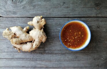 Ginger sauce on wood background