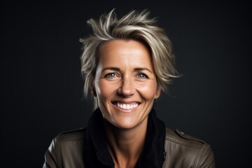 Portrait of a beautiful middle aged woman smiling at the camera.