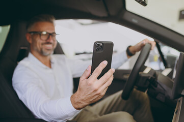 Adult fun man customer male buyer client wear shirt do selfie mobile cell phone drive car choose...