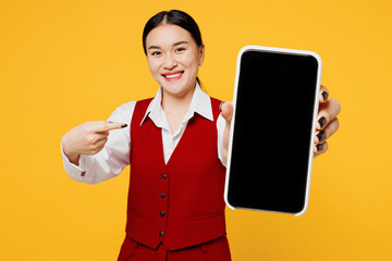 Young lawyer employee business woman of Asian ethnicity wear red vest shirt work at office hold use...