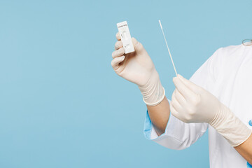 Close up cropped of female doctor holding in hand coronavirus covid-19 rapid test result isolated...