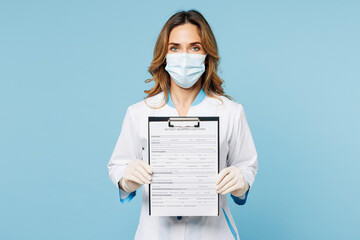 Female doctor woman wear white medical gown suit mask gloves work in hospital clinic office hold...