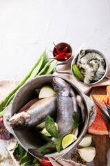 Fresh fish and ingredients for cooking. Raw fish.