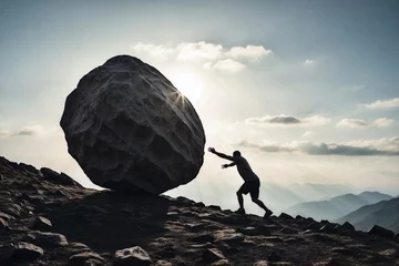 Fotobehang silhouette of person tries to move a rock, motivation in sport concept © Денис Богдан