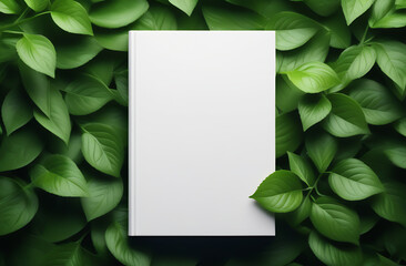 Book cover mockup on green leaf background