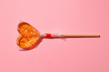 Store-bought colorful lollipop in packaging close-up