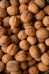 Top view of whole walnuts as background texture