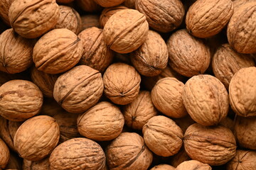 Top view of whole walnuts as background texture