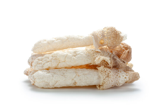 Heap of dried bamboo mushroom on white background. Dictyophora indusiata
