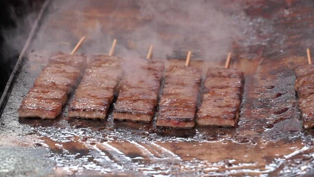 Roasting wagyu beef steaks street food in Japan