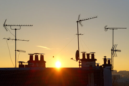 Roofs and outdoor tv antenna in Paris suburb - Powered by Adobe