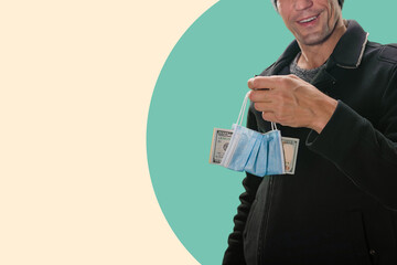 Smiling man holding money in medical mask because of lockdown crisis, Financial scrutiny: Man examines money bills in a close-up, navigating the nuances of payments.