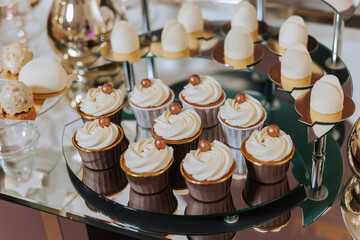 Candy bar at a wedding. Delicious desserts. Beautiful decorations. Fruits. Sweet cakes on your holiday. Birthday. Sweet life.
