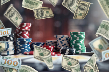 poker chips stack on table at casino, rain money fly dollar as big chance to win