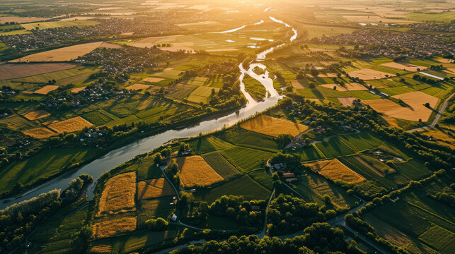 Aerial view of Green and Yellow agriculture field from above captured during sunrise