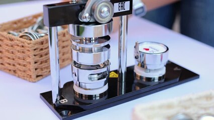 Mechanical manual press. Children and adults make badges .