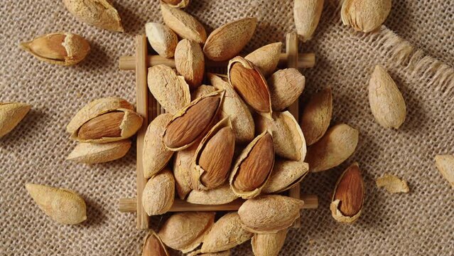Closeup of almonds，organic badam on table.