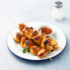 Homemade chicken skewers with mango chutney