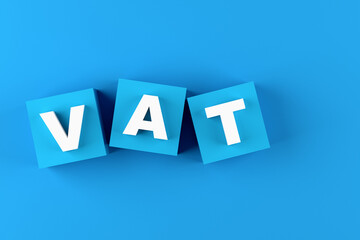 Value added tax concept. The acronym VAT on blue cube blocks.