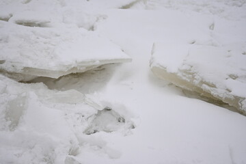 fragments of split people on the river, chunks of people on the river, spring ice drifting