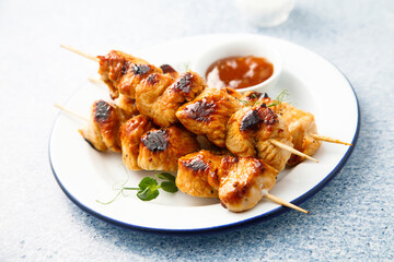 Homemade chicken skewers with mango chutney