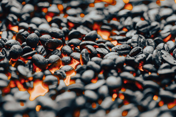 Roasted coffee beans with smoke and fire background. Close up,