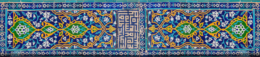 Traditional Uzbek pattern on the ceramic tile on the wall of the madrasah. Banner. Registan,...