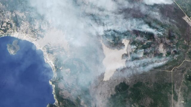 Aerial view of wildfire smoke as seen from space. Near Crater Lake National Park, Oregon. Elements Furnished by NASA